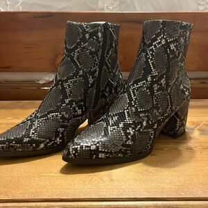 Black, gray, and white snake print boot with heel. Brand is Madden Girl. Size 9